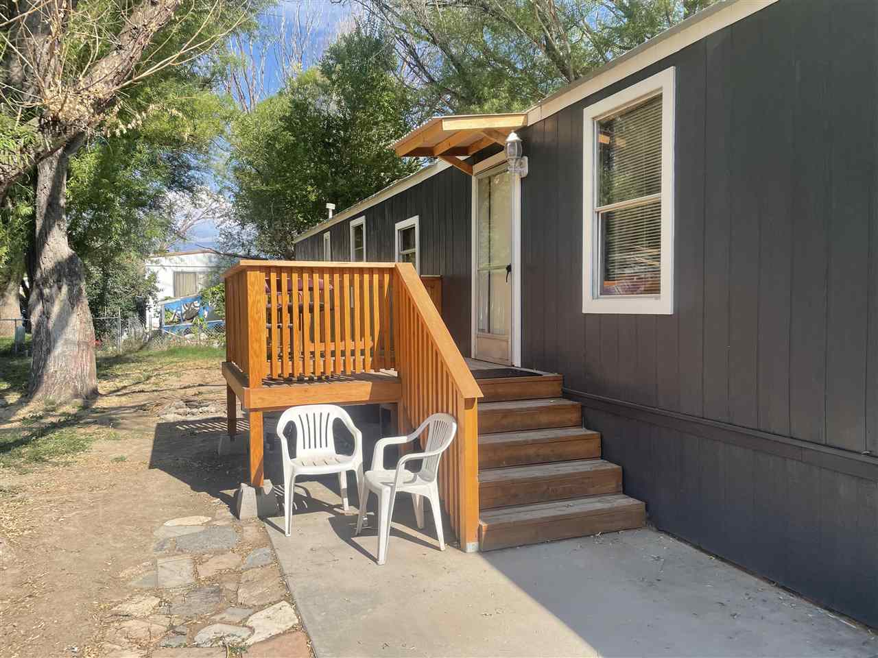 3268 E Road, Unit 43 Clifton, CO 81520 - Photo 2 of 15 a view of backyard with roof deck and chair