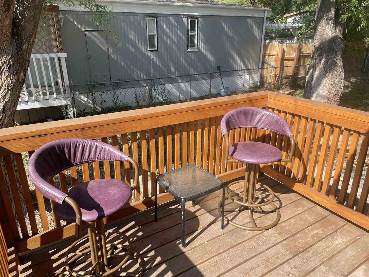 3268 E Road, Unit 43 Clifton, CO 81520 - Photo 3 of 15 a backyard of a house with table and chairs
