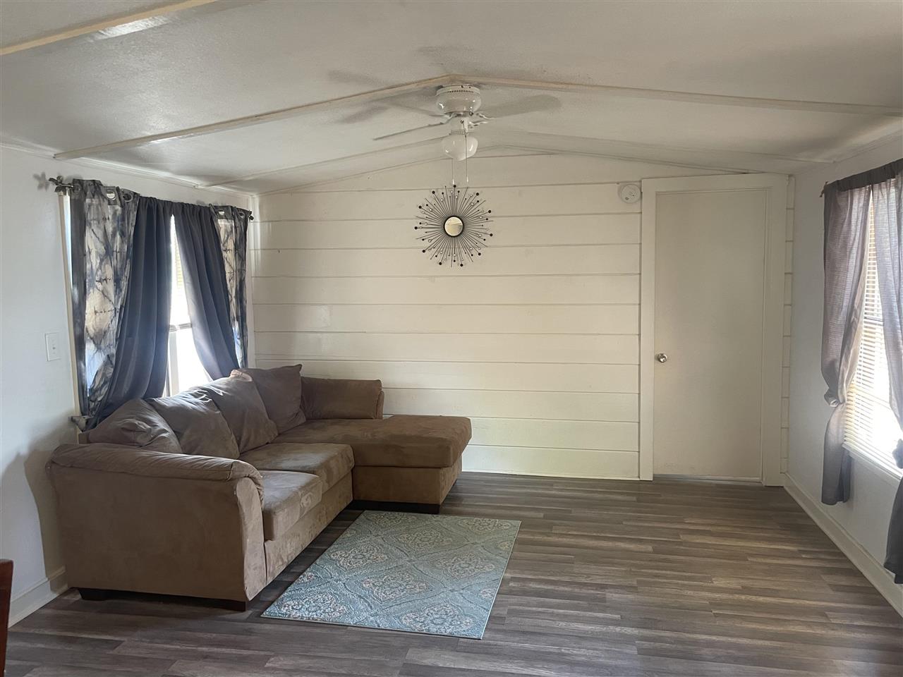 3268 E Road, Unit 43 Clifton, CO 81520 - Photo 8 of 15 a living room with furniture and a fireplace
