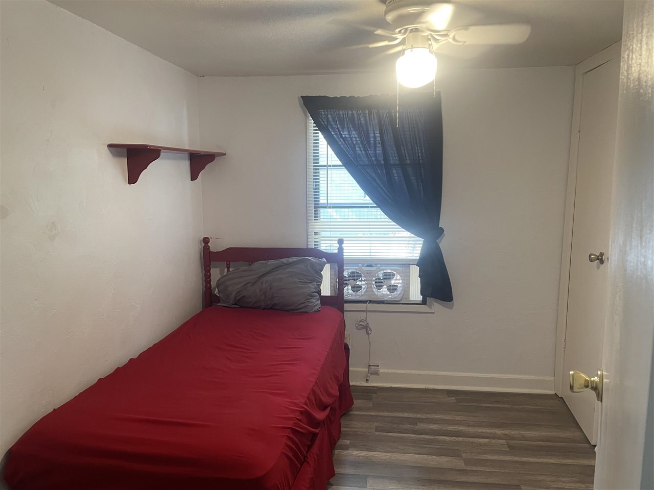 3268 E Road, Unit 43 Clifton, CO 81520 - Photo 10 of 15 a bedroom with a large bed and a chandelier