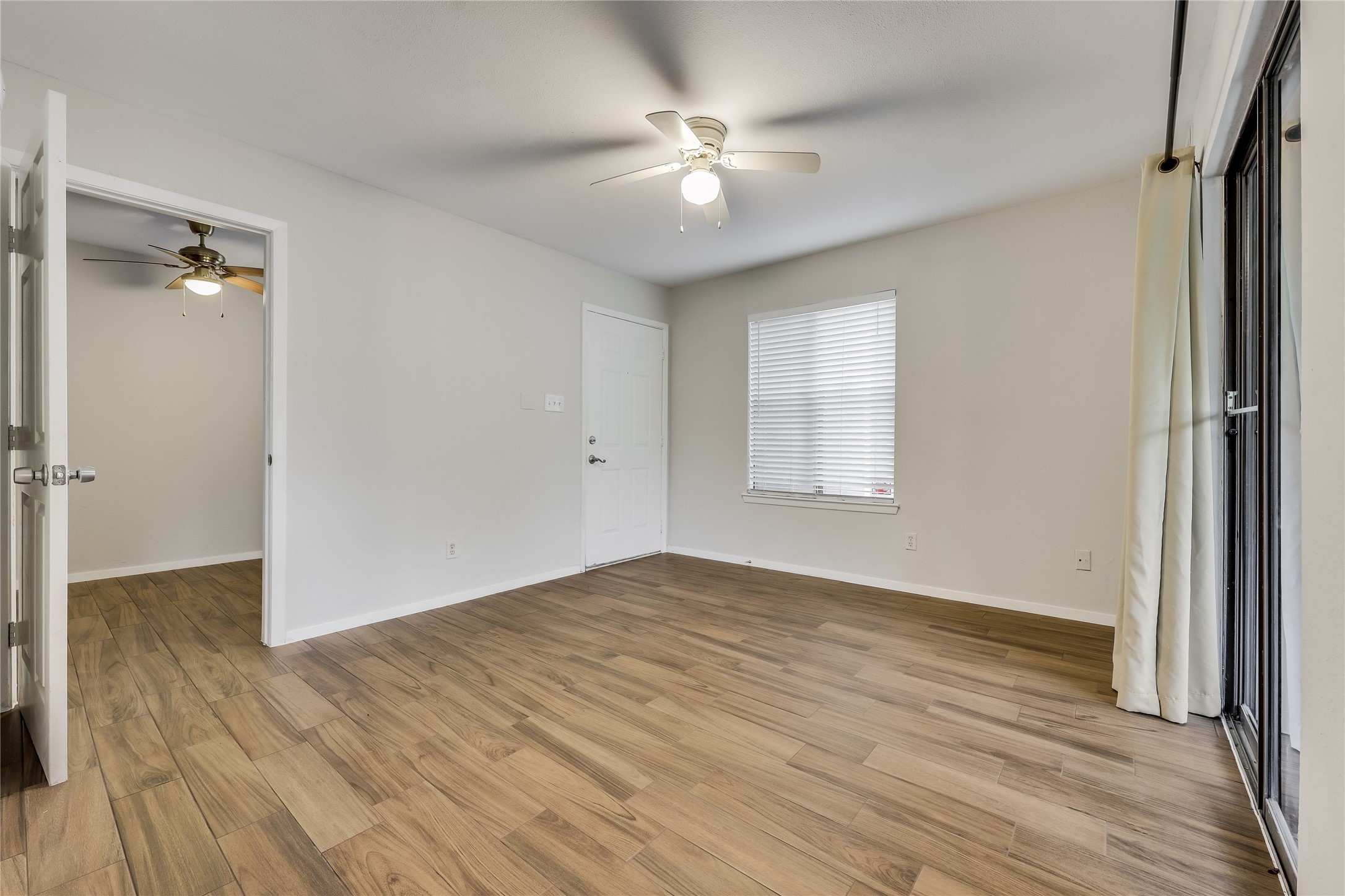 2500 Burleson Road, Unit 609 Austin, TX 78741 - Photo 16 of 32 Laminate wood flooring extends throughout this versatile room, featuring a private entrance and window for natural light.