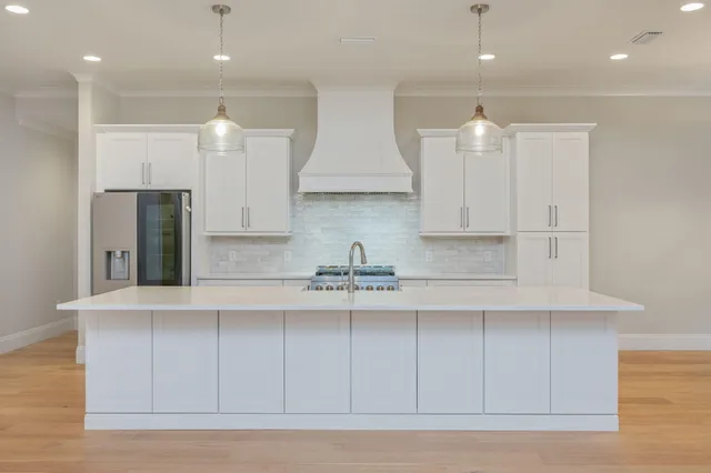 a kitchen with a sink and a fireplace