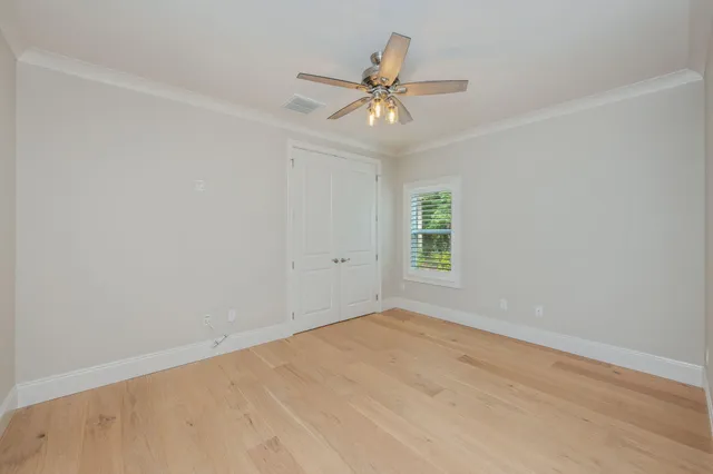 a view of a kitchen with white cabinets and white appliances