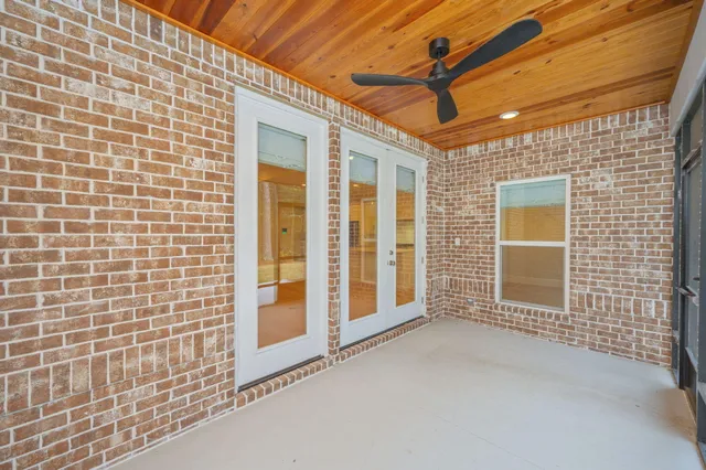 an aerial view of a house with a garden and pool