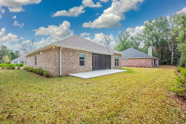 a view of a park with large trees