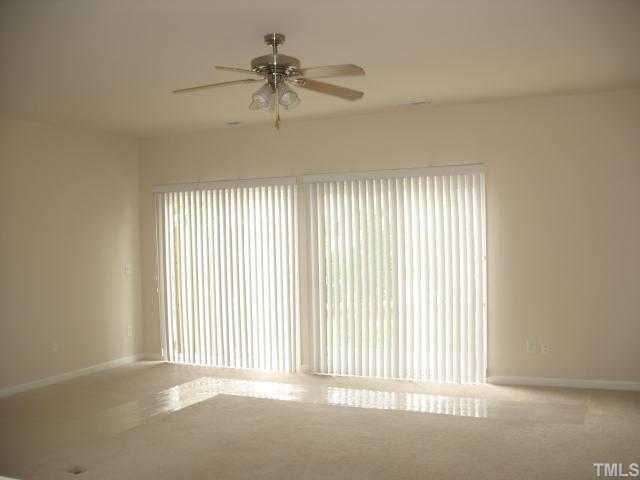 8309 Clasara Circle Raleigh, NC 27613 - Photo 4 of 9 a view of an empty room with a window