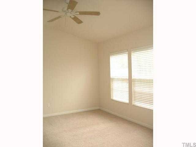 8309 Clasara Circle Raleigh, NC 27613 - Photo 5 of 9 a view of an empty room with a window