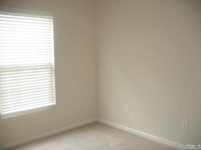 8309 Clasara Circle Raleigh, NC 27613 - Photo 6 of 9 an empty room with a window