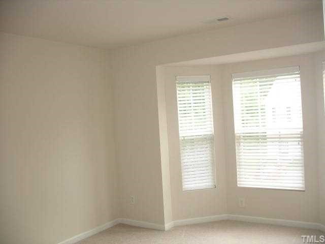 8309 Clasara Circle Raleigh, NC 27613 - Photo 7 of 9 a view of an empty room with a window