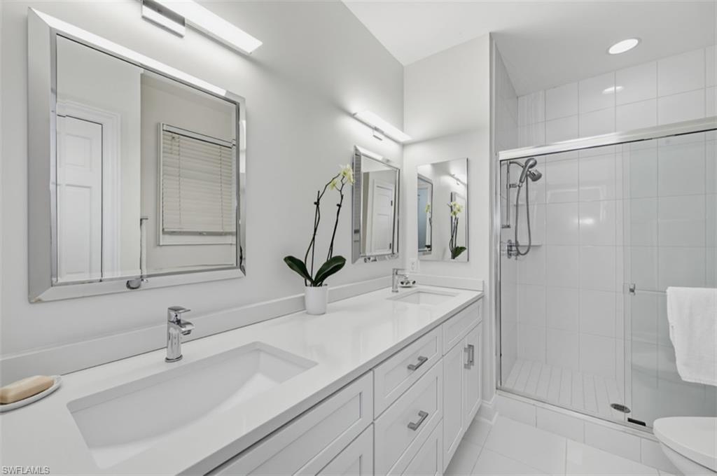 512 Turtle Hatch Road Naples, FL 34103 - Photo 15 of 18 Primary bath accented by oversized shower & quartz counters
