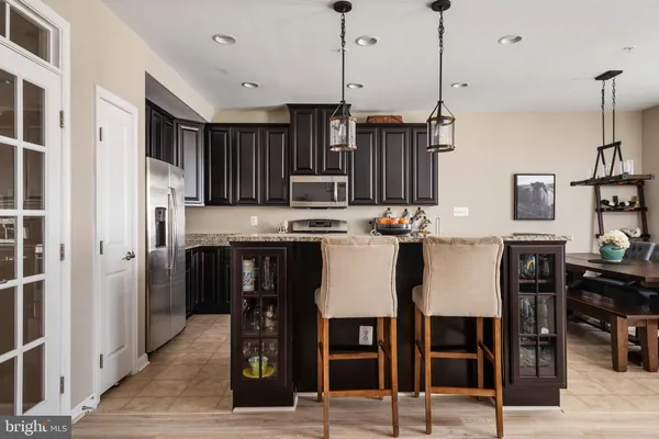 a view of kitchen with cabinets and stainless steel appliances