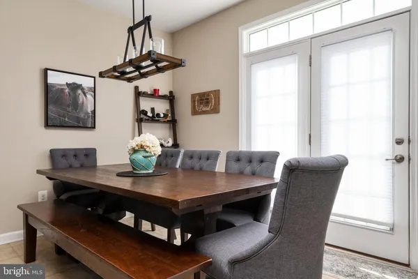 a view of a dining room with furniture and window