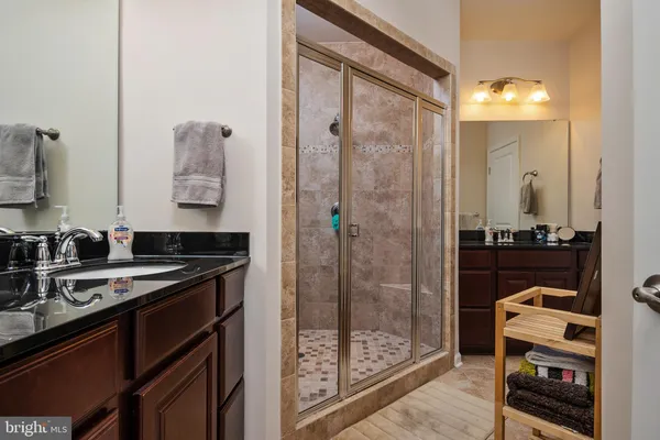 a kitchen with a refrigerator and a sink