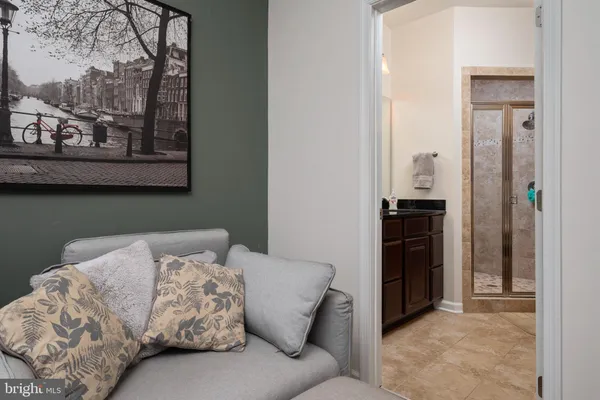 a bedroom with a bed and cabinet