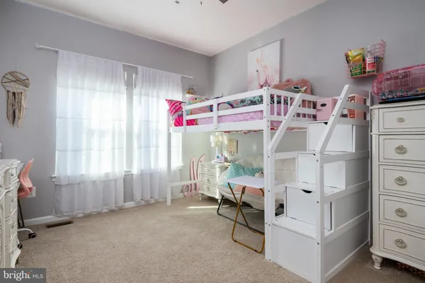 a room with a bed and a window