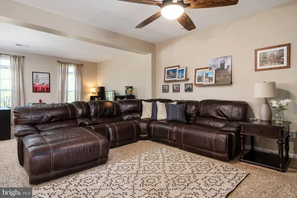a living room with furniture and a rug