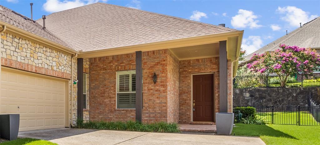 719 Scenic Ranch Circle Fairview, TX 75069 - Photo 4 of 36 a front view of a house with a garden