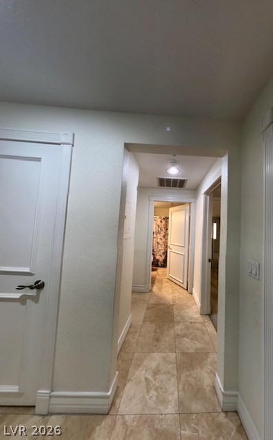 270 East Flamingo Road, Unit 336 Las Vegas, NV 89169 - Photo 7 of 11 This inviting hallway features elegant tile flooring and leads to various rooms within the home.