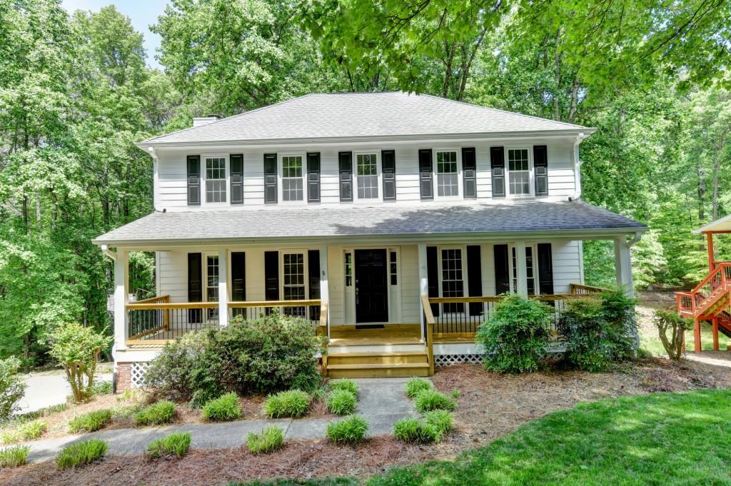 3791 Old Bridge Way Duluth, GA 30096 - Photo 1 of 58 a front view of a house with yard and green space