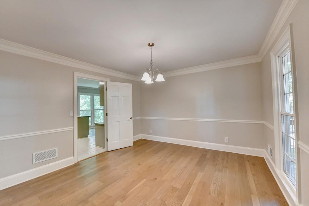 3791 Old Bridge Way Duluth, GA 30096 - Photo 16 of 58 wooden floor in an empty room with a window