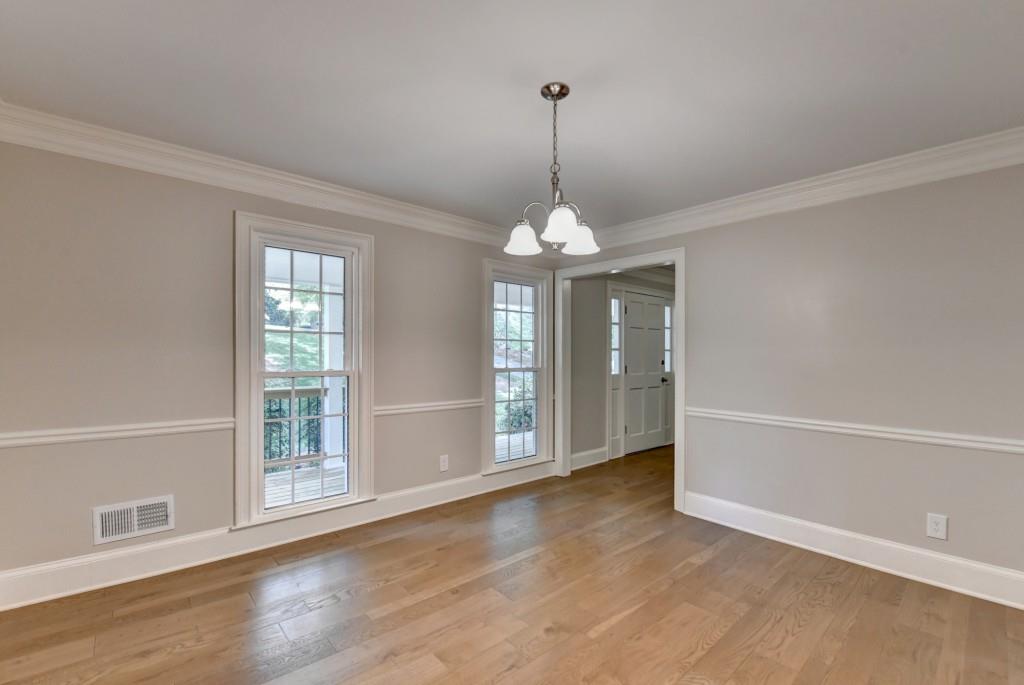 3791 Old Bridge Way Duluth, GA 30096 - Photo 17 of 58 a view of an empty room with window and wooden floor