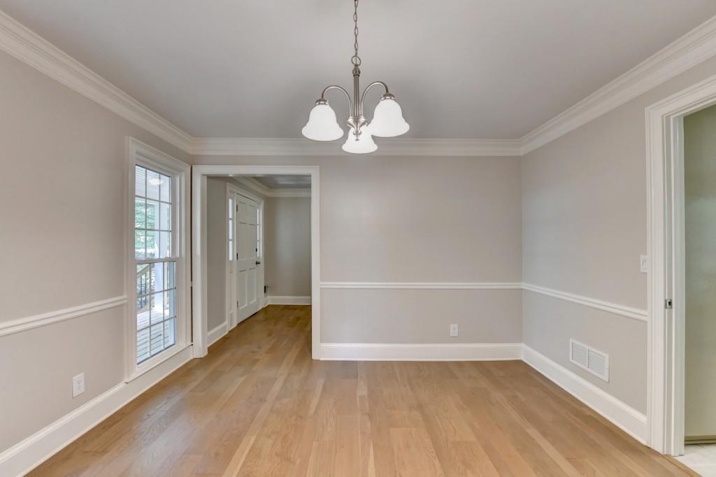 3791 Old Bridge Way Duluth, GA 30096 - Photo 18 of 58 a view of an empty room with a window and wooden floor