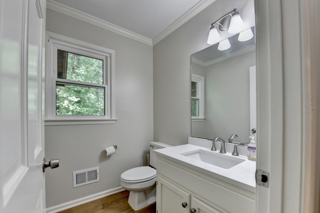 3791 Old Bridge Way Duluth, GA 30096 - Photo 28 of 58 a bathroom with a toilet sink and mirror