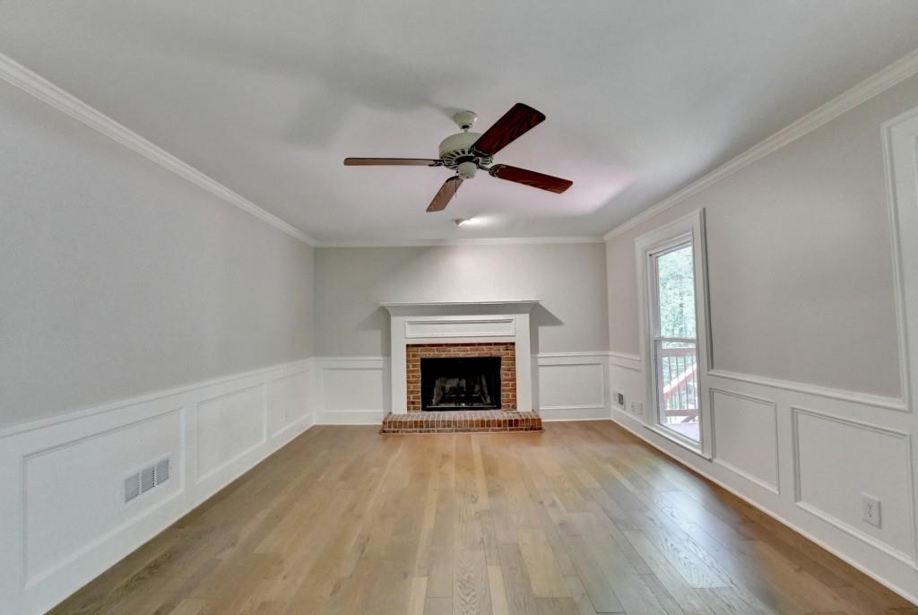 3791 Old Bridge Way Duluth, GA 30096 - Photo 29 of 58 wooden floor fireplace and windows in an empty room