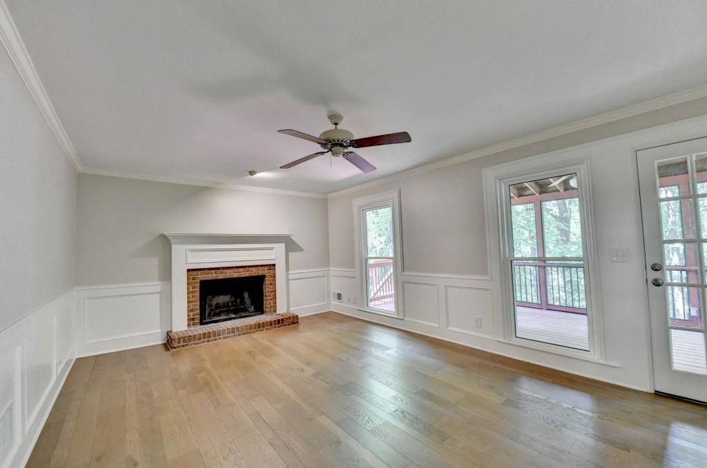 3791 Old Bridge Way Duluth, GA 30096 - Photo 31 of 58 wooden floor fireplace and windows in an empty room