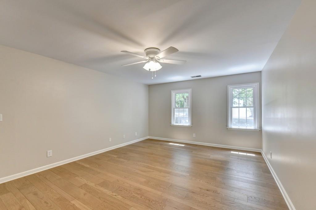3791 Old Bridge Way Duluth, GA 30096 - Photo 33 of 58 an empty room with window and ceiling fan