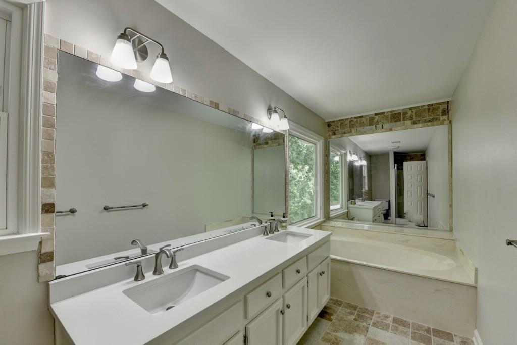 3791 Old Bridge Way Duluth, GA 30096 - Photo 36 of 58 a bathroom with a double vanity sink and a mirror