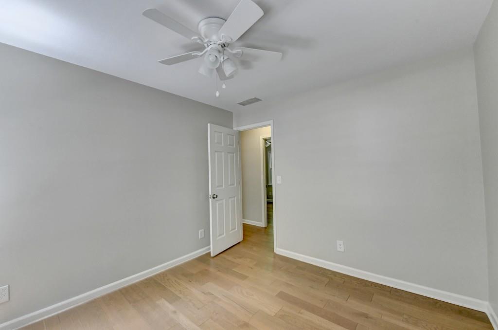 3791 Old Bridge Way Duluth, GA 30096 - Photo 40 of 58 an empty room with a chandelier fan