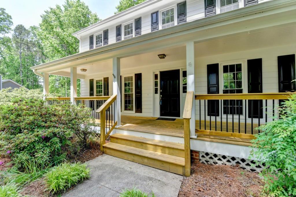 3791 Old Bridge Way Duluth, GA 30096 - Photo 4 of 58 a front view of a house with a yard