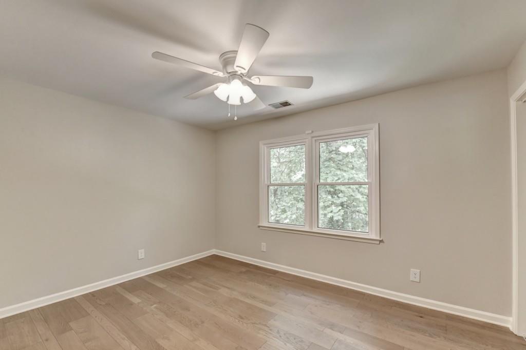 3791 Old Bridge Way Duluth, GA 30096 - Photo 42 of 58 an empty room with a window and a fan