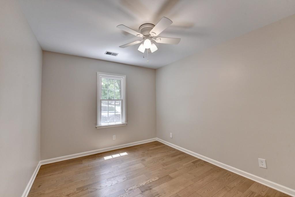 3791 Old Bridge Way Duluth, GA 30096 - Photo 46 of 58 wooden floor in an empty room with a window