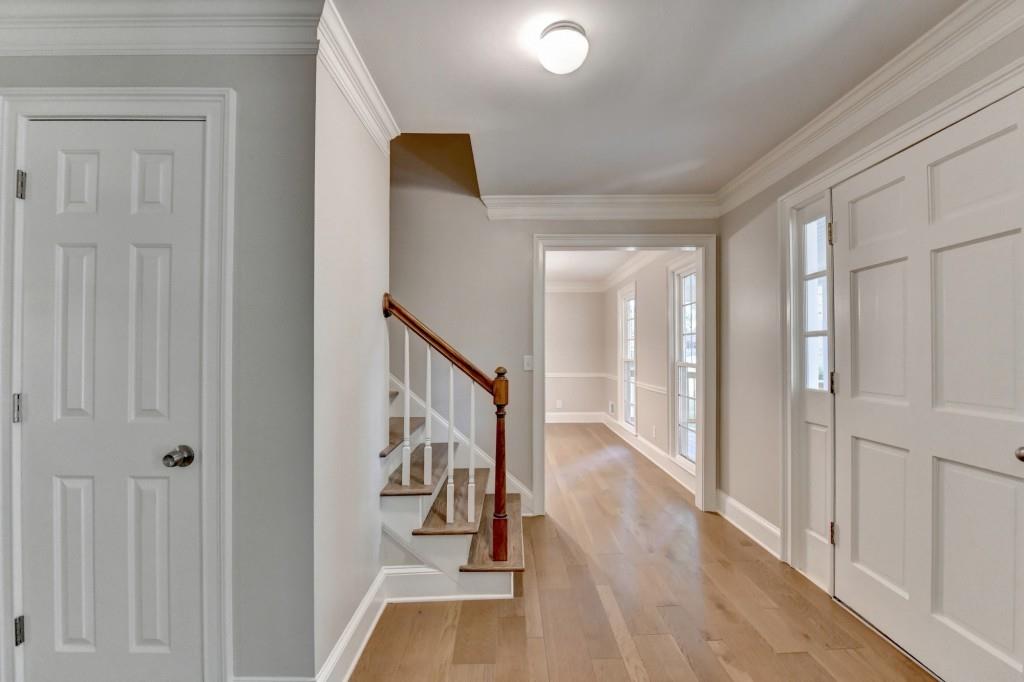 3791 Old Bridge Way Duluth, GA 30096 - Photo 10 of 58 a view of a hallway with wooden floor and staircase