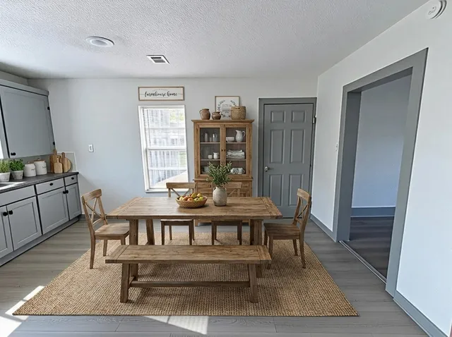 a view of a dining room with furniture window and wooden floor