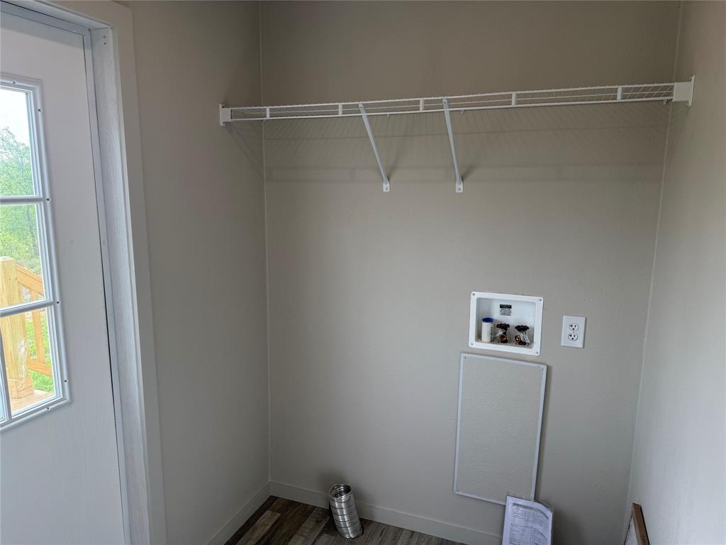 358 Reast Road Whitesboro, TX 76273 - Photo 12 of 21 a view of a room with rack on the wall and a window