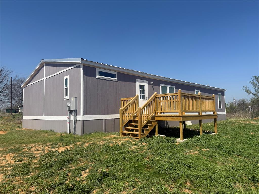 358 Reast Road Whitesboro, TX 76273 - Photo 18 of 21 a front view of a house with garden
