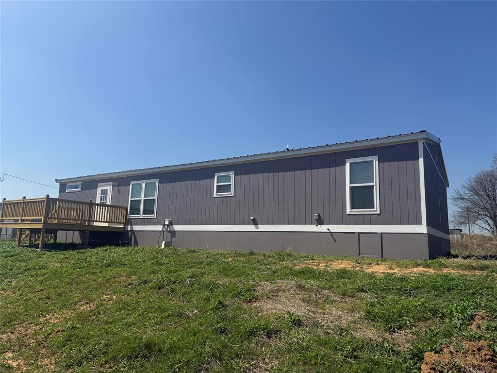 358 Reast Road Whitesboro, TX 76273 - Photo 20 of 21 a backyard of a house with wooden fence