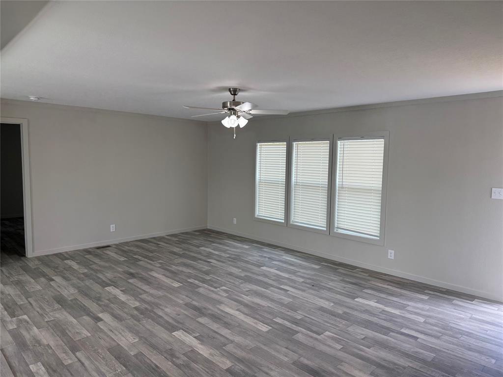 358 Reast Road Whitesboro, TX 76273 - Photo 6 of 21 a view of an empty room with a window