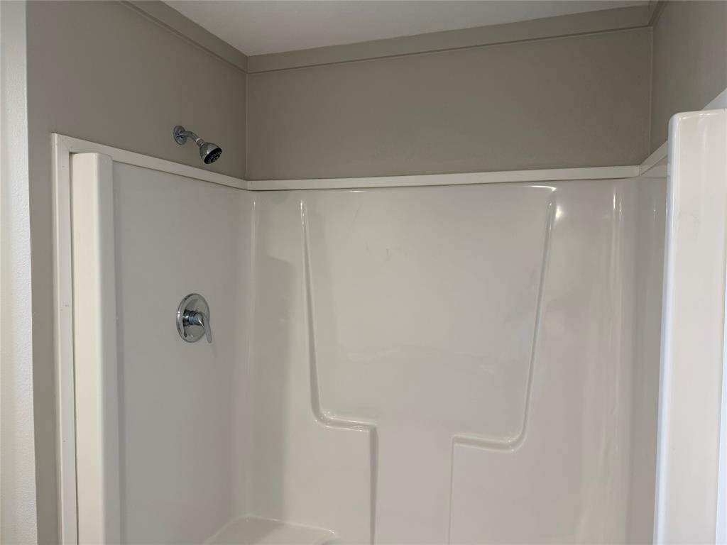 358 Reast Road Whitesboro, TX 76273 - Photo 10 of 21 a bathroom with a shower