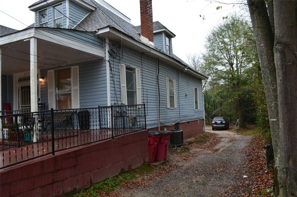 251 Ward Street Macon, GA 31201 - Photo 2 of 14 a view of house with a yard and wooden fence