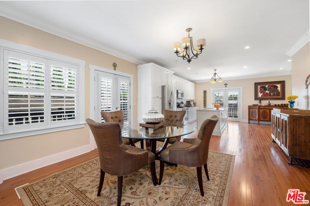 4530 West Washington Boulevard Los Angeles, CA 90016 - Photo 11 of 46 a view of a dining room with furniture window and wooden floor
