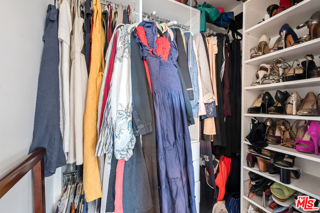 4530 West Washington Boulevard Los Angeles, CA 90016 - Photo 29 of 46 a view of walk in closet with clothes and shoes