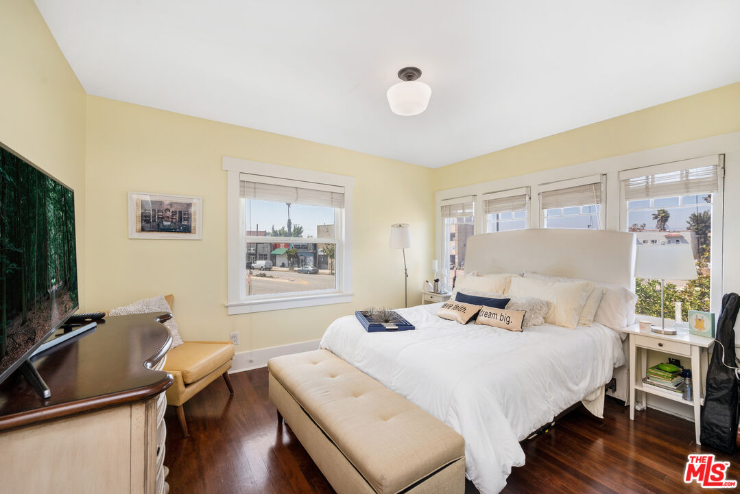 4530 West Washington Boulevard Los Angeles, CA 90016 - Photo 32 of 46 a bedroom with a bed and a flat screen tv