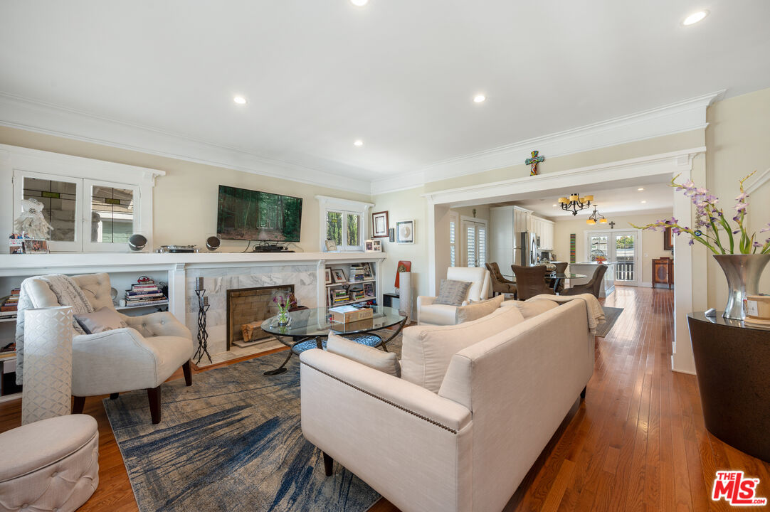 4530 West Washington Boulevard Los Angeles, CA 90016 - Photo 6 of 46 a living room with furniture a fireplace and a flat screen tv