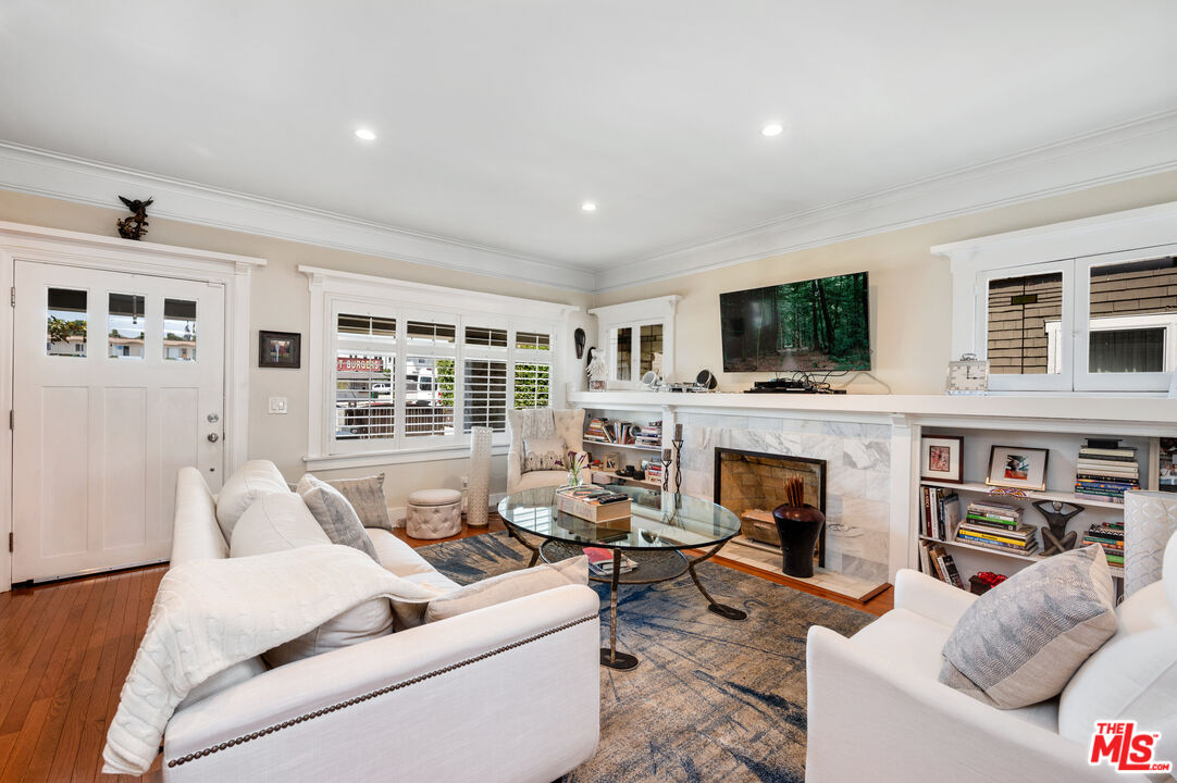4530 West Washington Boulevard Los Angeles, CA 90016 - Photo 7 of 46 a living room with furniture and a fireplace