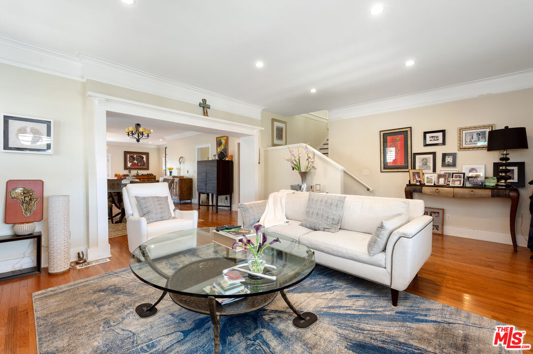 4530 West Washington Boulevard Los Angeles, CA 90016 - Photo 9 of 46 a living room with furniture and a dining table with wooden floor