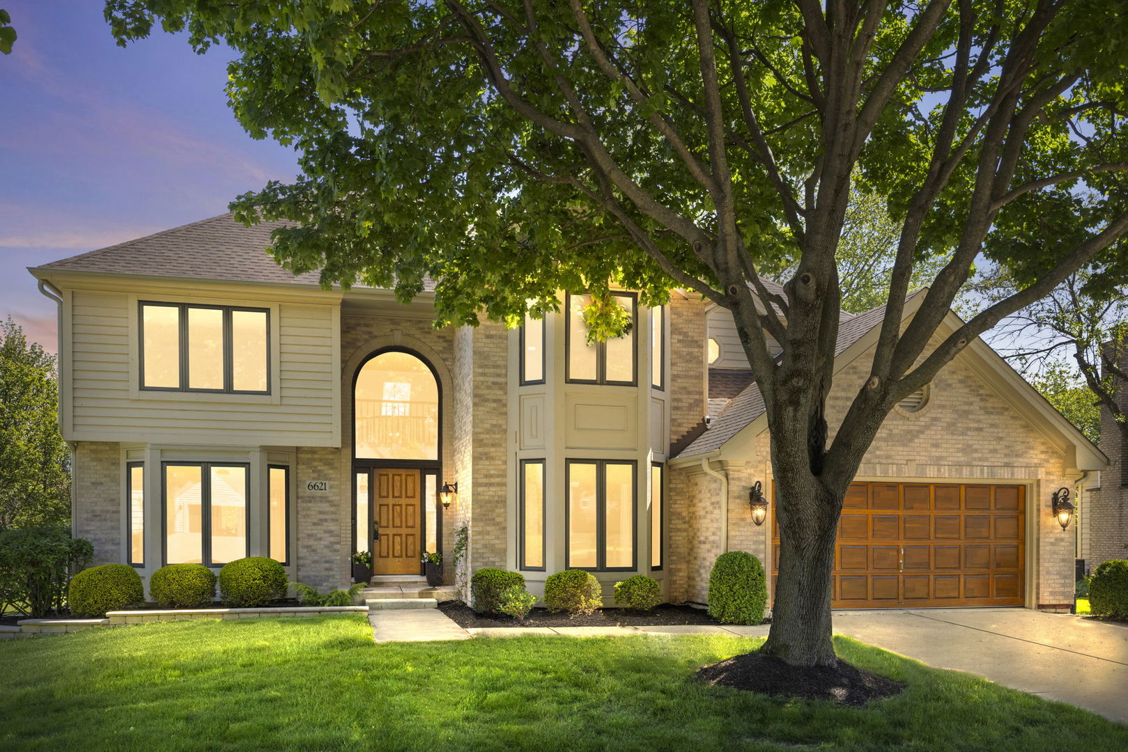6621 Greene Road Woodridge, IL 60517 - Photo 1 of 42 a front view of a house with a garden